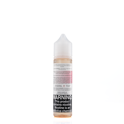A mister e-liquid bottle is placed on a reflective surface and against a white background. The bottle outlines the ingredients and the warning label. 