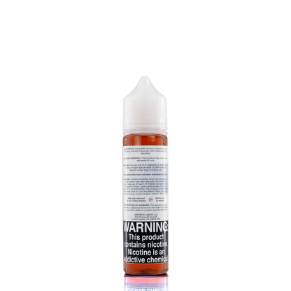 A mister e-liquid bottle is placed on a reflective surface and against a white background. The bottle outlines the ingredients and the warning label. 
